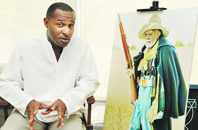 Essex Garner talks about the painting on which he is currently working. He is painting a series of Civil War portraits that will eventually be displayed in a case in Scruggs Student Center on the Jefferson City campus of Lincoln University. 