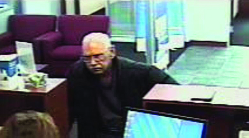 This Feb. 9 surveillance photo provided by the FBI shows 73-year-old Walter Unbehaun, an ex-convict from Rock Hill., S.C., during a bank robbery in Niles, Ill.