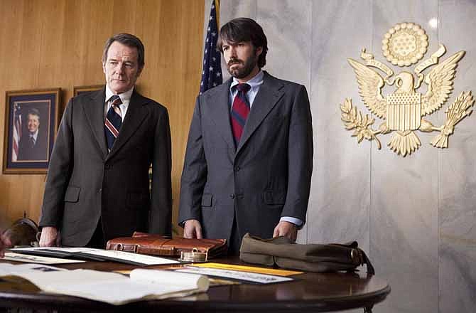 This film image released by Warner Bros. Pictures shows Bryan Cranston, left, as Jack O'Donnell and Ben Affleck as Tony Mendez in "Argo," a rescue thriller about the 1979 Iranian hostage crisis.