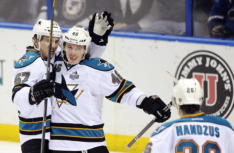 San Jose's Tim Kennedy (center) celebrates his game-winning goal against St. Louis with teammates Tommy Wingels (left) and Michal Handzus on Tuesday in St. Louis.