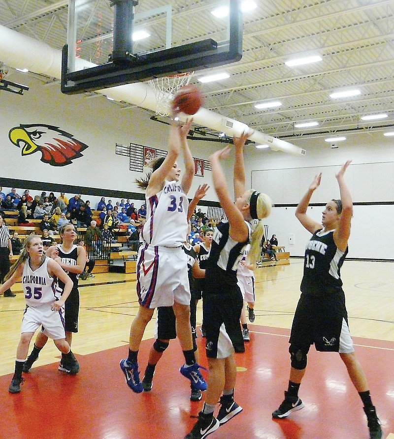 California junior Sydney Deeken (33) puts up a shot during the first-round game against Eugene Monday night during the Class 3 District 8 Tournament at Ashland. The Lady Pintos defeated the Lady Eagles 49-22 to advance to semifinals Wednesday (today) at 7:30 p.m.
