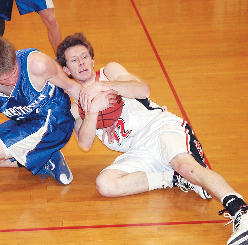 Prairie Home's Rayce Kendrick scrambles to get control of a loose ball during the varsity game against Jamestown Friday.