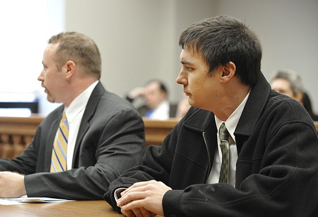 Former teacher Christopher Knehans, right, listens with his attorney Scott Hamblin, left, as Cole County Circuit Judge Dan Green orders him to begin serving a 60-day sentence immediately. 