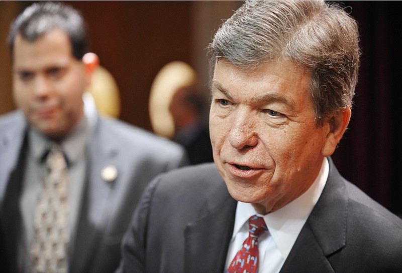 Missouri Senator Roy Blunt answers reporters' questions after addressing the Missouri House of Representatives Wednesday.