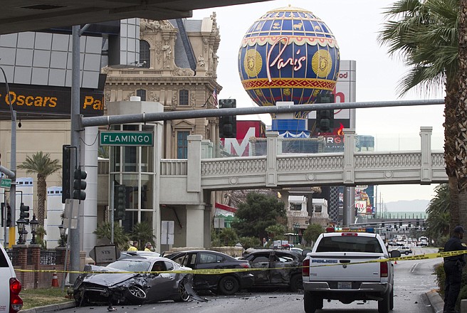 Police rope off the scene of a shooting and multi-car accident on the Las Vegas Strip early Thursday. 