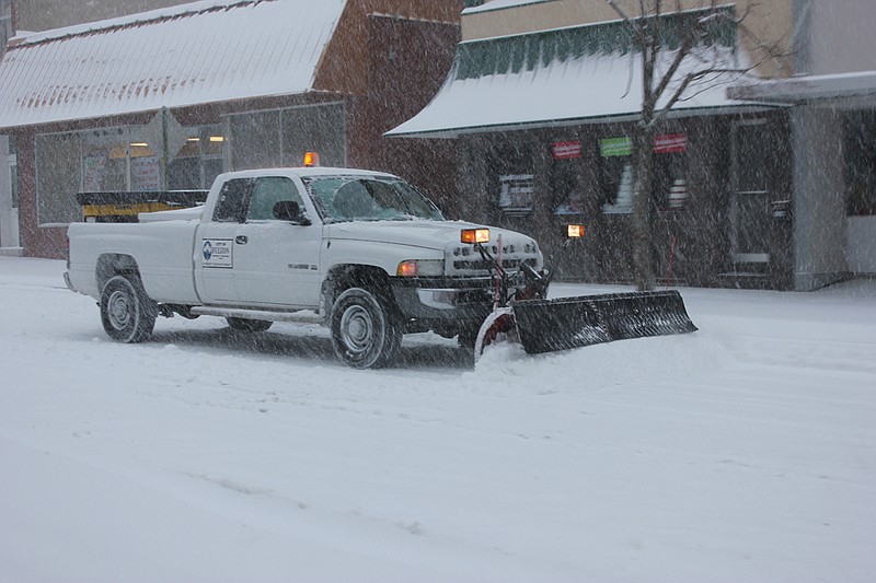 One of Fulton's seven snow plows fights to keep Court Street clear during torrential snowfall Thursday. Winter Storm Q put several inches on the ground early in Callaway County, forcing many schools, buildings and businesses to close.