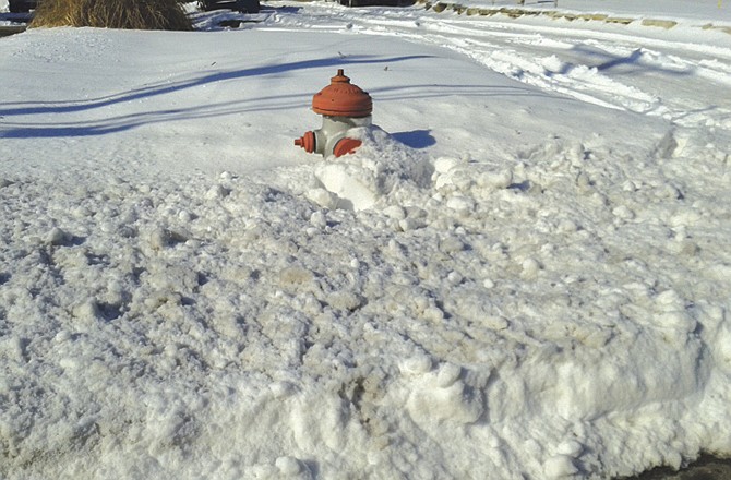 Jefferson City firefighters spent time Saturday looking for and clearing away snow from fire hydrants like this one. They're hoping citizens will help by avoiding throwing any extra snow around the hydrants.