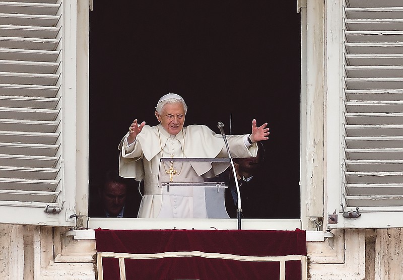 Pope Benedict XVI delivers his blessing during his last Angelus noon prayer, from the window of his studio overlooking St. Peter's Square, at the Vatican.