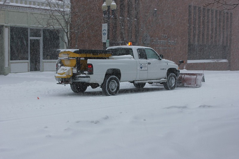 A Fulton truck plows and salts Court Street in front of The Callaway Bank during Thursday's snowstorm. City Engineer Greg Hayes said the city began planning early for more snow, which was expected Monday night and this morning.