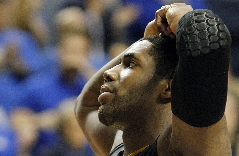 Alex Oriakhi of Missouri reacts during the closing moments of Saturday night's overtime loss to Kentucky in Lexington, Ky.