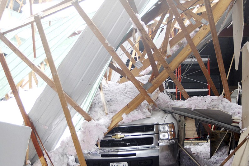 Heavy snow on the roof of the 10,000-square-foot Central Missouri Vault Co. on Route TT near New Bloomfield collapsed shortly before 7 a.m. Tuesday, causing debris to fall on trucks and other equipment at the concrete vault manufacturing firm.