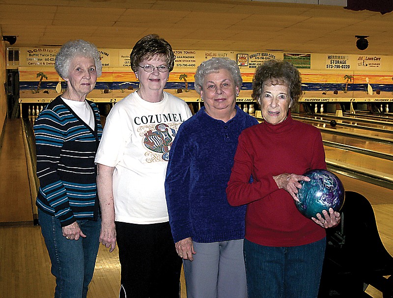 Rita Marshall, 90, with a bowling ball, bowls regularly with her team at California Lanes. From left are Peggy Ernst, Carol Jungmeyer, Bonnie Muri and Rita Marshall.

