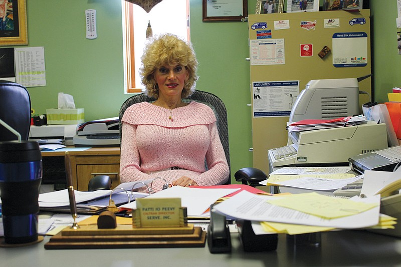 CALTRAN Program Director Patti Jo Peevy sits at the desk she will soon be vacating when she retires after 34 years of organizing the county's rural transit system. In her tenure, Peevy grew CALTRAN from a one-van operation to a program 10 vehicles, 10 drivers and two office staff that serve Callaway and mid-Missouri.