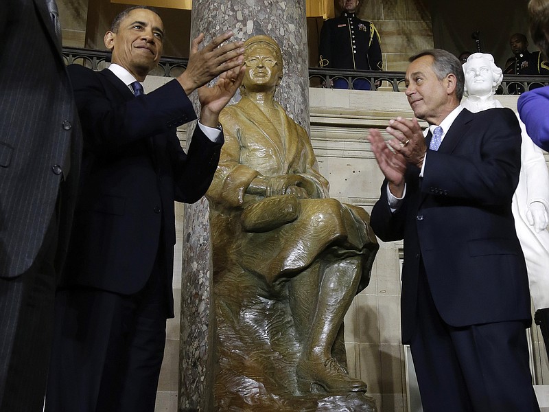 President Barack Obama and House Speaker John Boehner of Ohio applaud Wednesday at the unveiling of a statue of Rosa Parks on Capitol Hill in Washington. 
