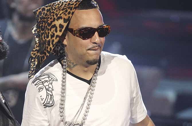 This July file photo shows French Montana on stage at the BET Awards in Los Angeles. A driver opened fire on a crowd of people surrounding the tour bus of rapper French Montana after a concert Thursday in Philadelphia, killing one person and injuring another.