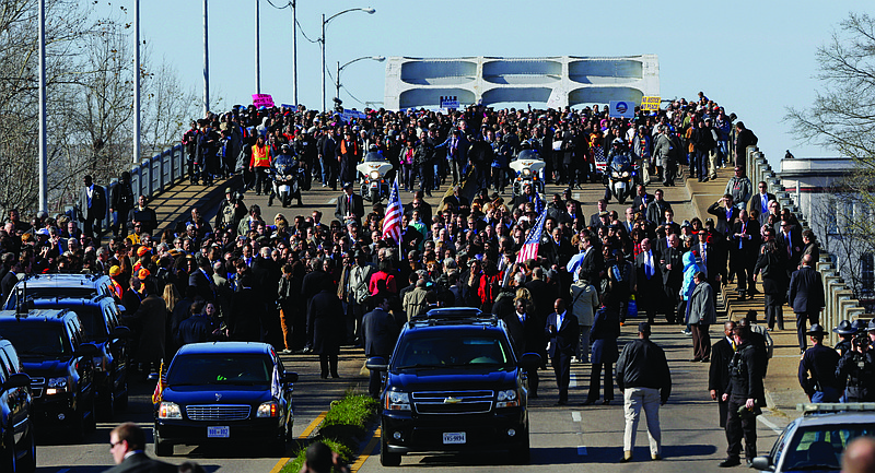 Vice President Joe Biden and other lawmakers lead a group across the Edmund Pettus Bridge in Selma, Ala., Sunday. They were commemorating the 48th anniversary of Bloody Sunday, when police officers beat marchers when they crossed the bridge on a march from Selma to Montgomery.