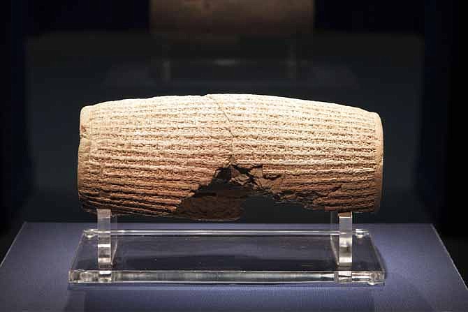 The Cyrus Cylinder is seen on display at the Smithsonian's Freer Sackler Gallery in Washington. The 2,500-year-old Babylonian artifact sometimes described as the world's first human rights charter will be shown for the first time in the United States at the gallery, followed by stops in New York, Houston and Los Angeles.