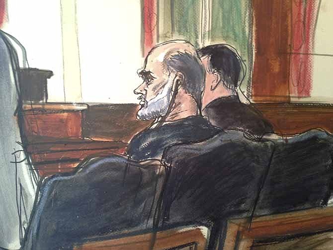 In this courtroom drawing, Osama bin Laden's son-in-law, Sulaiman Abu Ghaith, center, listens to a tranlator, as his federal defender, left, speaks Friday in U.S. federal court in New York. Through his lawyer, Abu Ghaith pleaded not guilty to conspiracy to kill Americans in his role as al-Qaida's top spokesman.