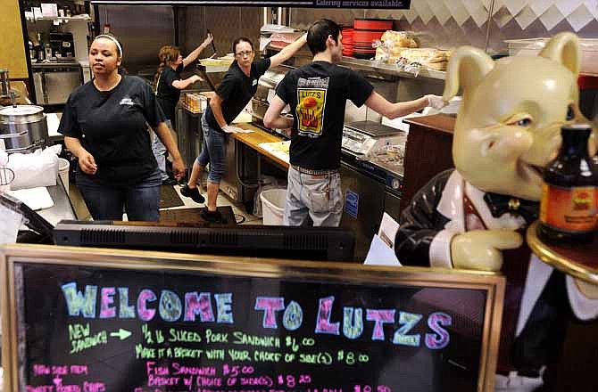 Employees at Lutz's BBQ in Jefferson City wear black to honor their friend and coworker, 19-year-old Chelsea Fredrickson of Camdenton, who was killed Wednesday night in a two-vehicle collision.