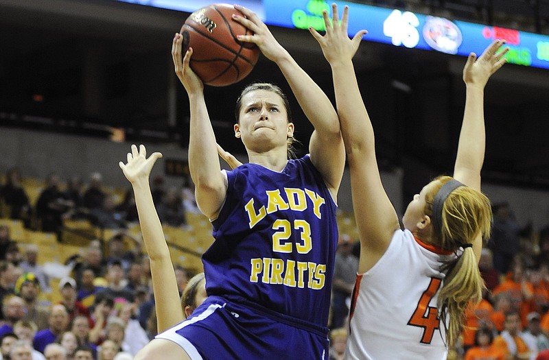 Miranda Brandt of Chamois cuts between Walnut Grove defenders Lexi Harman (left) and Madisyn Freeze on her way to a game-tying jumper in the final minute of Saturday night's Class 1 girls state championship game at Mizzou Arena.