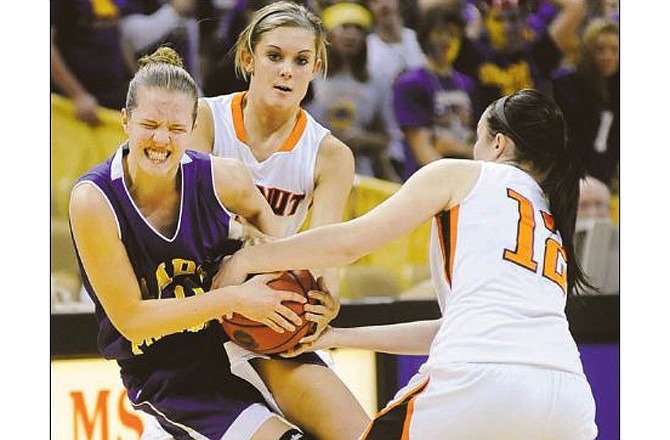 Alison Mehmert of Chamois battles with Walnut Grove's Lexi Harman (center) and Miranda Allison for control of the ball during Saturday night's Missouri Class 1 girls basketball championship game at Mizzou Arena. 