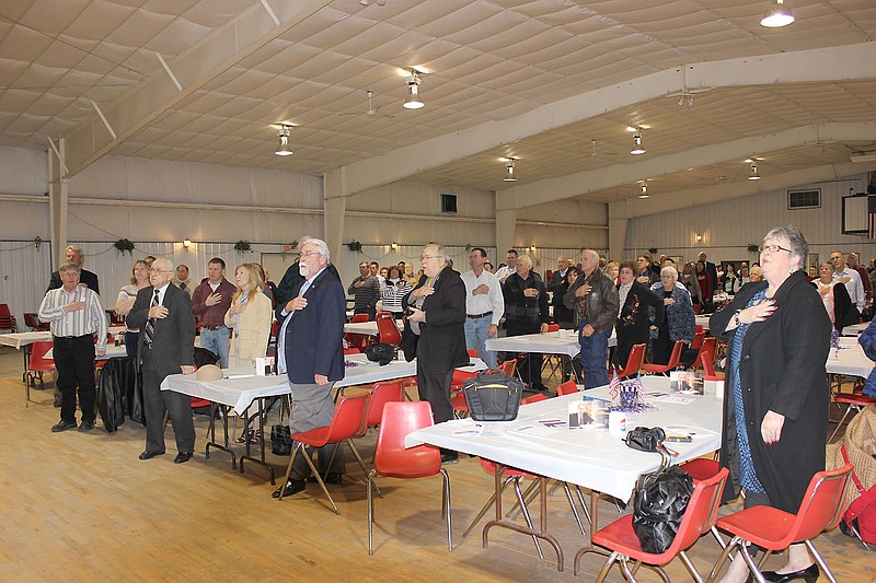 Attendees recite the Pledge of Allegiance at the 2013 Callaway Lincoln Day celebration in Kingdom City Monday night.
