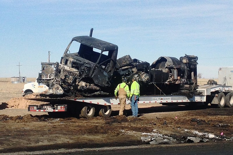 Charred remains are seen Monday after a fatal wreck Sunday between a tanker loaded with fuel and a car with five teens near Dumas, Texas. The deaths of the five Texas teens came the same day as an accident in Ohio that killed six and a day before a crash in Illinois killed four.