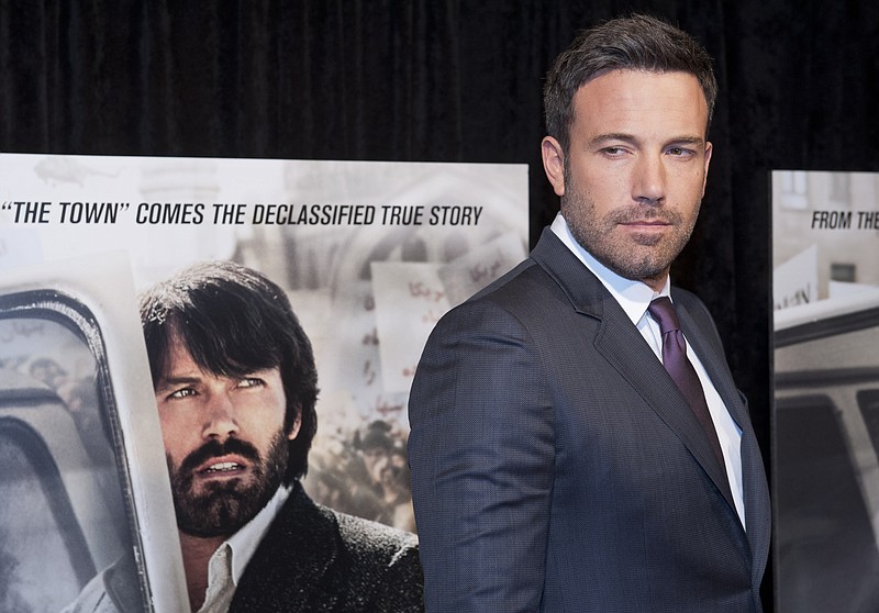 Director and actor Ben Affleck poses for photographers at the premiere of his film Argo in Washington, D.C. Iranian media reported Tuesday that authorities are planning to sue Hollywood over the Oscar-winning "Argo" because of the movie's allegedly "unrealistic portrayal" of the country.