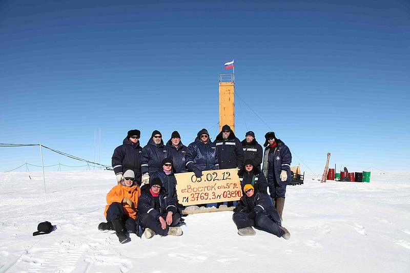 Russian researchers at the Vostok station in Antarctica on Feb. 6, 2012, pose for a picture after reaching subglacial lake Vostok. Russian scientists said Monday that a new form of microbial life has been found in water samples taken from the giant freshwater lake hidden under kilometers of Antarctic ice.