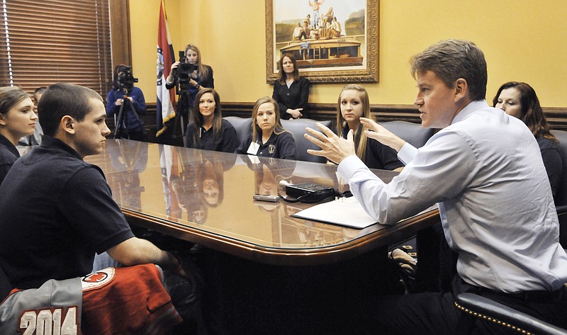 Timothy McPherson, near left, a junior from Tuscumbia High School was among several students from the Mid-Missouri town to visit Attorney General Chris Koster's office Tuesday to share the results of the student-led anti-bullying program at the elementary and secondary schools.