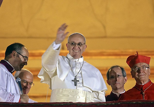 Pope Francis waves to the crowd Wednesday from the central balcony of St. Peter's Basilica at the Vatican. Cardinal Jorge Bergoglio, who chose the name of Francis, is the 266th pontiff of the Roman Catholic Church. 