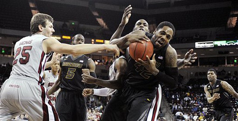 Missouri's Alex Oriakhi (42) draws the foul as South Carolina's Mindaugas Kacinas (25) defends during their game last month in Columbia, S.C. 