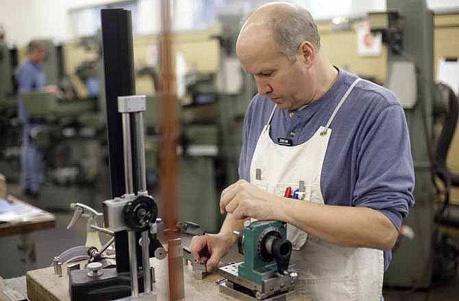 Toolmakers work at The Rodon Group manufacturing facility, Tuesday, March 12, 2013, in Hatfield, Pa. There are three jobs open at Rodon Group, a plastic parts manufacturer near Philadelphia. But despite the reports of a shortage of skilled workers nationwide, CEO Michael Araten isn't sweating it.