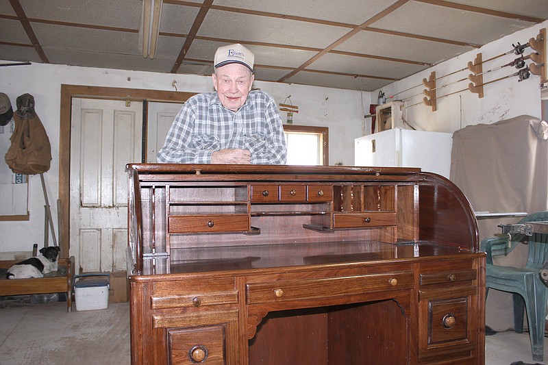 Hugh Staats of Fulton built this roll-top desk for his son, Arnie, this winter. Furniture making has been a lifelong hobby for Staats, who built many of the pieces in his home.