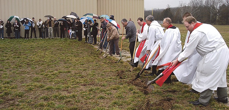The Rev. Sam Powell of Trinity Lutheran Church (far right) and other area Lutheran pastors are among those who helped break ground on Sunday for phase two of Calvary Lutheran High School's construction.