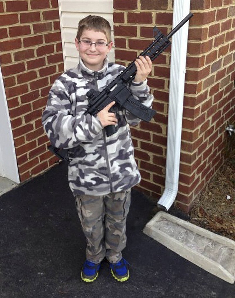 The Moore family claims this photo, posted on Facebook, led the state's child welfare agency to the family's house, Friday, March 15, demanding to be let inside to inspect their guns. 
