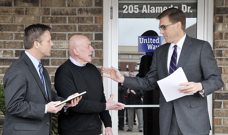 Dan Westhues, right, chairman of the board for the United Way of Central Missouri, thanks Allen Hollander, middle, and Craig Lammers for their generosity in helping find the United Way a new home. Lammers is CEO of the local YMCA and Hollander is chair of YMCA's board. The United Way hosted an open house to show off their new facility at 205 Alameda Street.