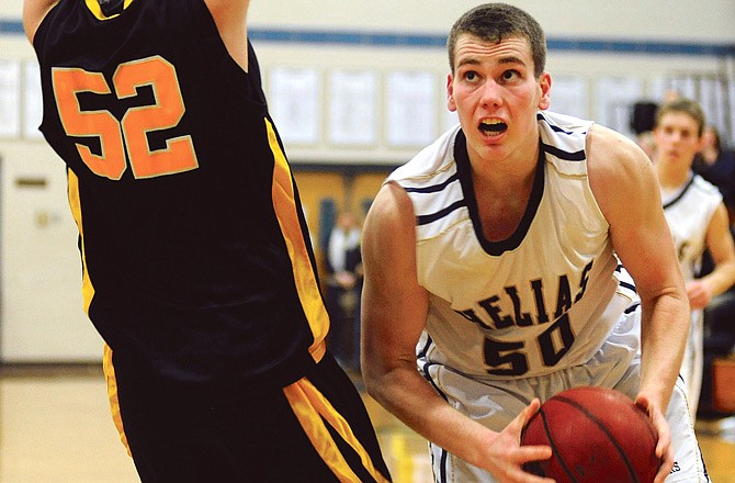 Helias center Hale Hentges eyes the basket during a game against Fulton this season.