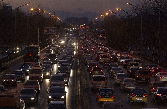 Vehicles pack a main road during rush hour in Beijing. China, which overtook the U.S. late last year as the world's largest oil importer, has the single biggest influence on global demand for fuels. 