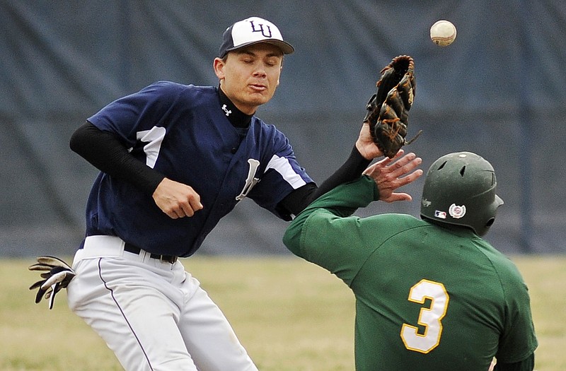 Lincoln shortstop Caleb Kemna has the ball knocked free from his glove by Missouri Southern's Zack Steadman as he steals second base during Friday's MIAA matchup at Lincoln Field.