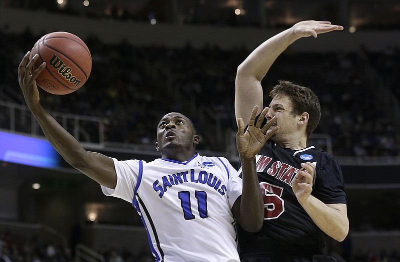 Saint Louis guard Mike McCall Jr. (11) shoots against New Mexico State guard Kevin Aronis (5) during Thursday's NCAA Tournament game in San Jose, Calif.