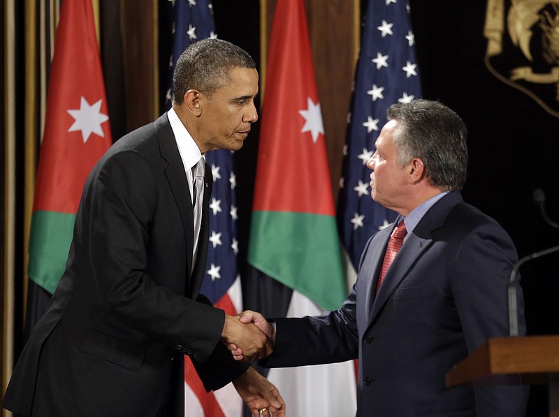 U.S. President Barack Obama and Jordan's King Abdullah II shake hands Friday following their joint news conference at the King's Palace in Amman, Jordan.
