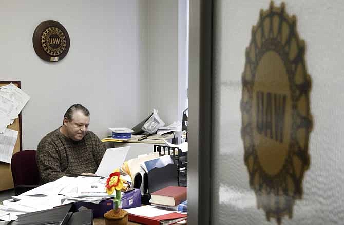 United Auto Workers Local 174 President John Zimmick works in his office in Romulus, Mich. on Friday March 22, 2013. Zimmick worries not just about his local - but the fate of all unions. 