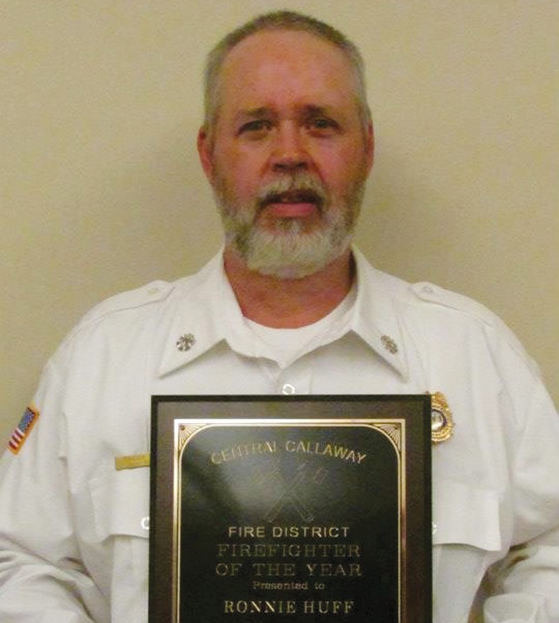 Central Callaway Fire District Assistant Chief Ronnie Huff holds the plaque he was presented with Saturday at the annual firefighter's dinner, where he was named the 2012 Firefighter of the Year. Huff has been a firefighter for 22 years, 12 of which were spent at Central Callaway.