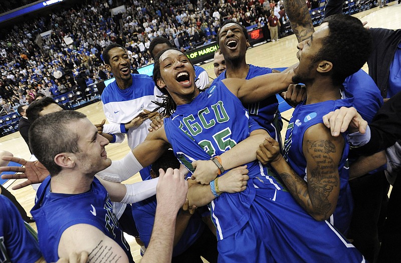 Florida Gulf Coast's Sherwood Brown (center) celebrates with teammates after Sunday's 81-71 win against San Diego State in the NCAA Tournament in Philadelphia. The Eagles are the lowest seed to ever reach the Sweet 16.