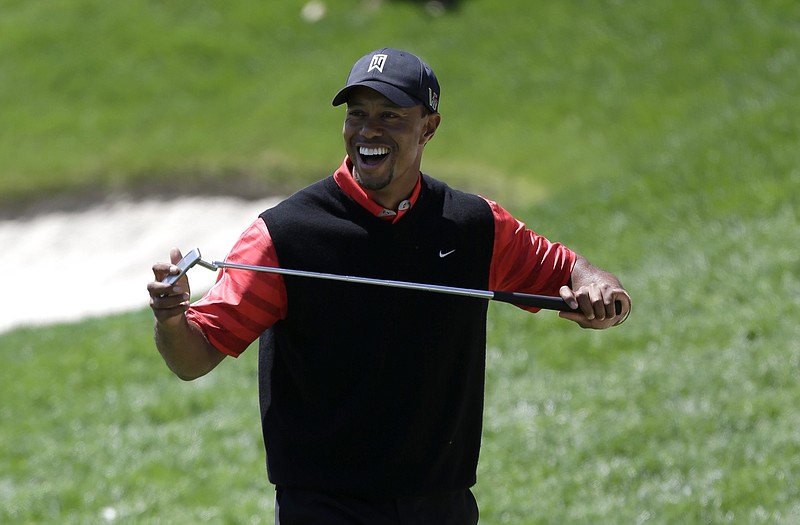 Tiger Woods laughs despite missing a putt during the final round of the Arnold Palmer Invitational on Monday in Orlando, Fla. Woods is now the top-ranked golfer in the world.