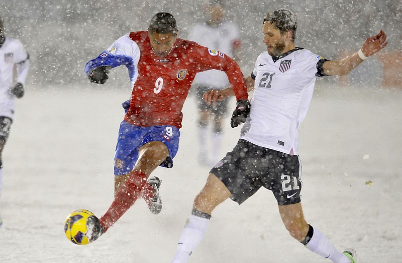 Costa Rica forward Alvaro Saborio (9) and United States defender Clarence Goodson (21) go after the ball during the second half of Friday's World Cup qualifier soccer match in Commerce City, Colo. The United States continues qualifying today against Mexico.