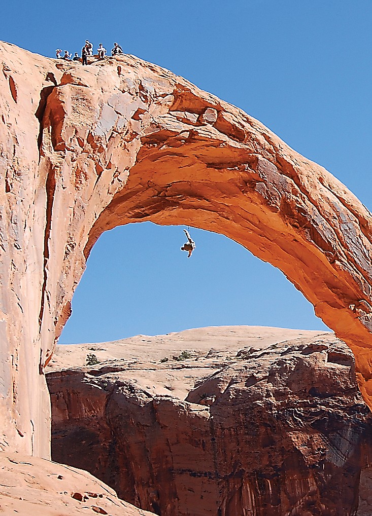 This photo taken Nov. 4, 2012, shows a person swinging from the Corona Arch near Moab, Utah. On Sunday, a 22-year-old man was killed trying to swing through the opening of the 110-foot sandstone arch in a stunt made popular on YouTube.