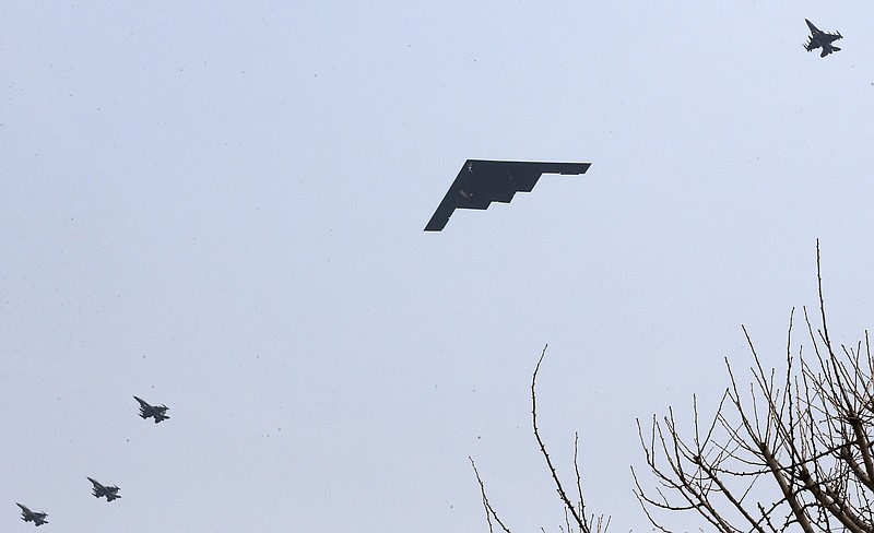 U.S. Air Force B-2 stealth bomber flies over near Osan U.S. Air Base in Pyeongtaek, south of Seoul, South Korea, Thursday. A day after shutting down a key military hotline, Pyongyang instead used indirect communications with Seoul to allow South Koreans to cross the heavily armed border and work at a factory complex that is the last major symbol of inter-Korean cooperation. 