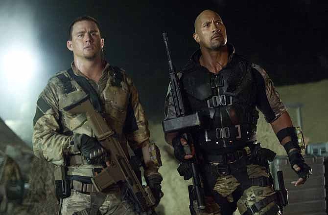 This film image released by Paramount Pictures shows Channing Tatum, left, and Dwayne Johnson in a scene from "G.I. Joe: Retaliation." 